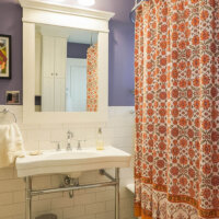 Thumbnail of http://Renovated%20bathroom%20with%20a%20sink%20and%20tub.%20The%20tub%20is%20blocked%20by%20a%20shower%20curtain.