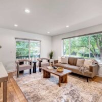 Thumbnail of http://Large%20living%20room%20with%20a%20couch,%20coffee%20table,%20and%20two%20chairs.%20The%20space%20also%20includes%20a%20large%20window%20above%20the%20couch%20and%20a%20sliding%20door%20behind%20the%20two%20chairs.
