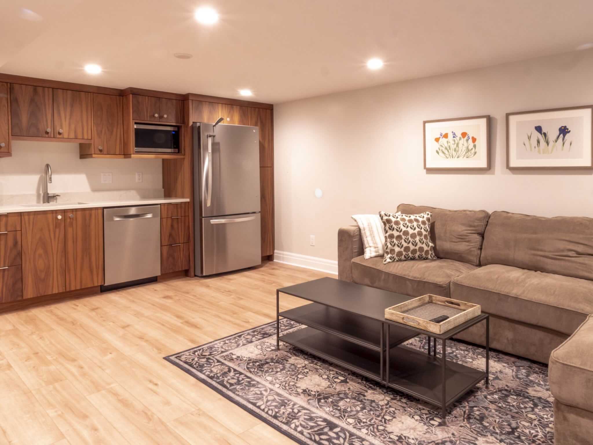 Basement apartment with a family room and kitchen.