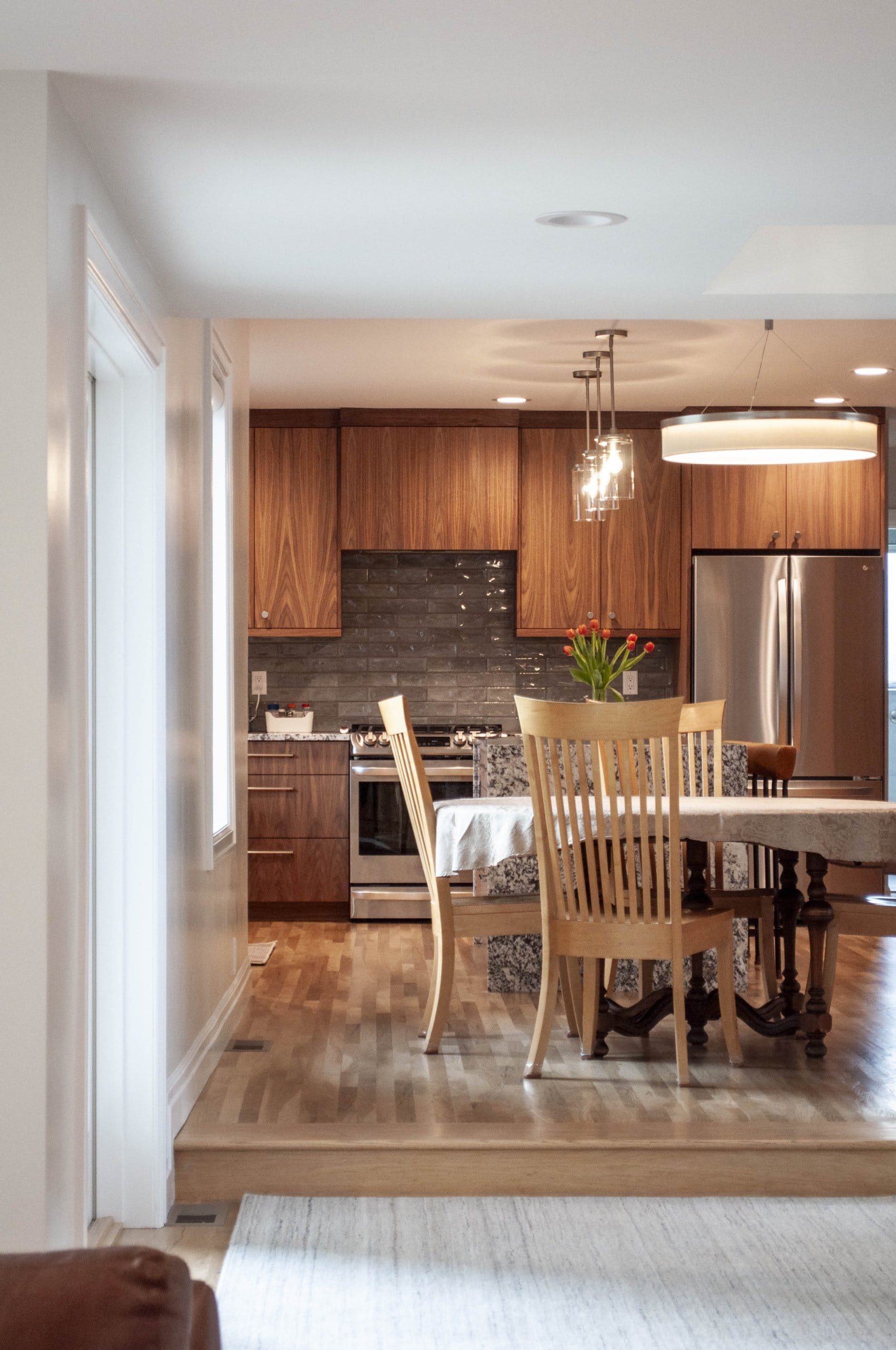 View from the family room to the dining room and kitchen.