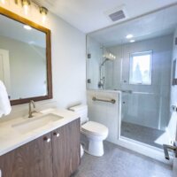 Thumbnail of http://Bathroom%20with%20sink,%20toilet,%20and%20large%20shower.