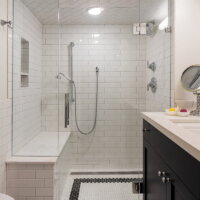 Thumbnail of http://Black%20and%20white%20tiled%20basement%20bathroom