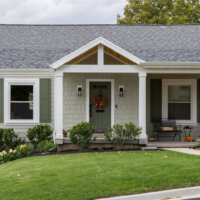 Thumbnail of http://Front%20exterior%20of%20cottage%20style%20home.%20The%20yard%20is%20landscaped%20with%20grass%20and%20includes%20a%20path%20with%20access%20to%20the%20front%20porch.