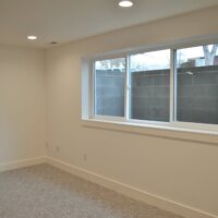 Thumbnail of http://Lower%20level%20room%20with%20large%20windows.