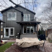 Thumbnail of http://Exterior%20of%20the%20two-story%20addition.%20In%20front%20of%20the%20addition,%20is%20a%20brick%20patio%20with%20outdoor%20furniture.