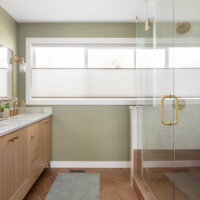Thumbnail of http://Primary%20bathroom%20with%20large%20window,%20double%20vanity,%20and%20shower.