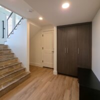Thumbnail of http://Basement%20mudroom%20design%20with%20built-in%20cabinets.