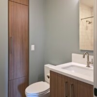 Thumbnail of http://Custom%20bathroom%20renovation%20with%20the%20sink,%20toilet,%20and%20a%20built-in.