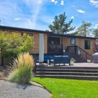 Thumbnail of http://Large%20backyard%20deck%20that%20is%20multiple%20levels.%20The%20deck%20extends%20from%20the%20house%20and%20down%20to%20the%20grass%20in%20the%20yard.