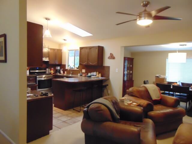 Closed off and dark living area and kitchen before the remodel.