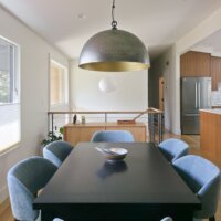 Thumbnail of http://Open%20concept%20modern%20dining%20room%20design%20with%20a%20table%20for%20six%20centered%20under%20the%20light.