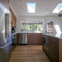 Thumbnail of http://Mid-century%20modern%20kitchen%20renovation%20featuring%20vaulted%20ceilings%20and%20an%20island%20in%20the%20center.