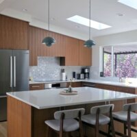 Thumbnail of http://Mid-century%20modern%20kitchen%20renovation%20featuring%20vaulted%20ceilings%20and%20an%20island%20in%20the%20center.