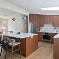 Thumbnail of http://Mid-century%20modern%20kitchen%20renovation%20featuring%20vaulted%20ceilings%20and%20an%20island%20in%20the%20center.