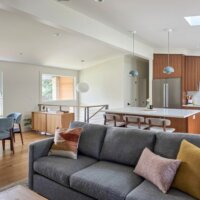 Thumbnail of http://Open%20concept%20living%20room,%20dining%20room,%20and%20kitchen%20after%20the%20renovation.%20The%20space%20features%20vaulted%20ceilings%20and%20lots%20of%20natural%20light.
