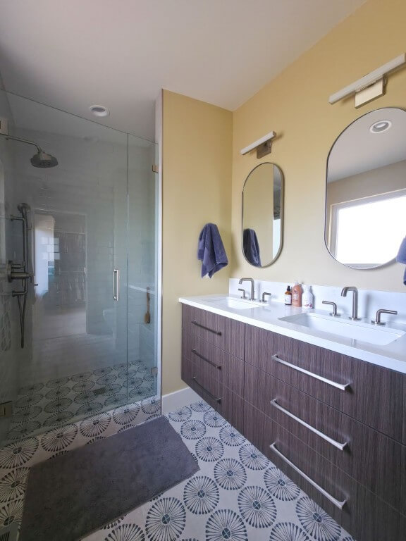 Primary suite with a double vanity and large shower.