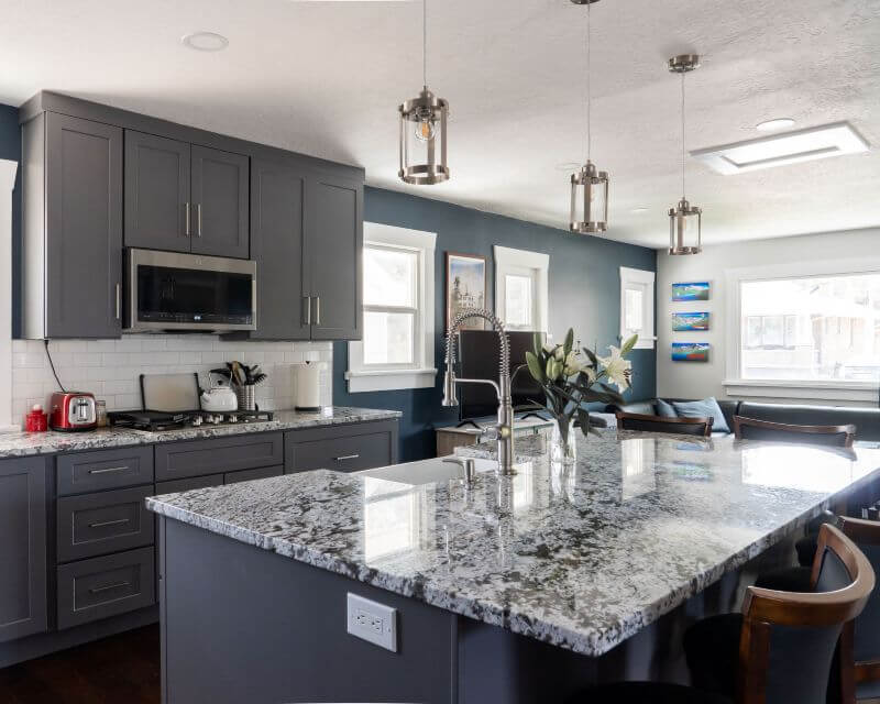 Renovated kitchen featuring an open concept layout with lots of storage, a large island, and clear sightlines.