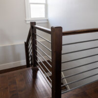 Thumbnail of http://Modern%20railing%20around%20the%20staircase%20to%20the%20basement.