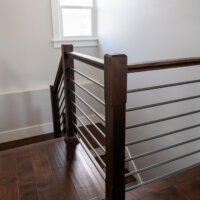 Thumbnail of http://Modern%20railing%20around%20the%20staircase%20to%20the%20basement.