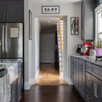 Thumbnail of http://Hallway%20opening%20between%20the%20renovated%20kitchen%20and%20rear%20addition%20from%20phase%20I.