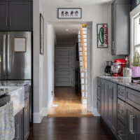 Thumbnail of http://Hallway%20opening%20between%20the%20renovated%20kitchen%20and%20rear%20addition%20from%20phase%20I.