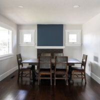 Thumbnail of http://Renovated%20dining%20room%20with%20a%20large%20table,%20windows,%20and%20fireplace.