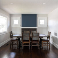 Thumbnail of http://Renovated%20dining%20room%20with%20a%20large%20table,%20windows,%20and%20fireplace.