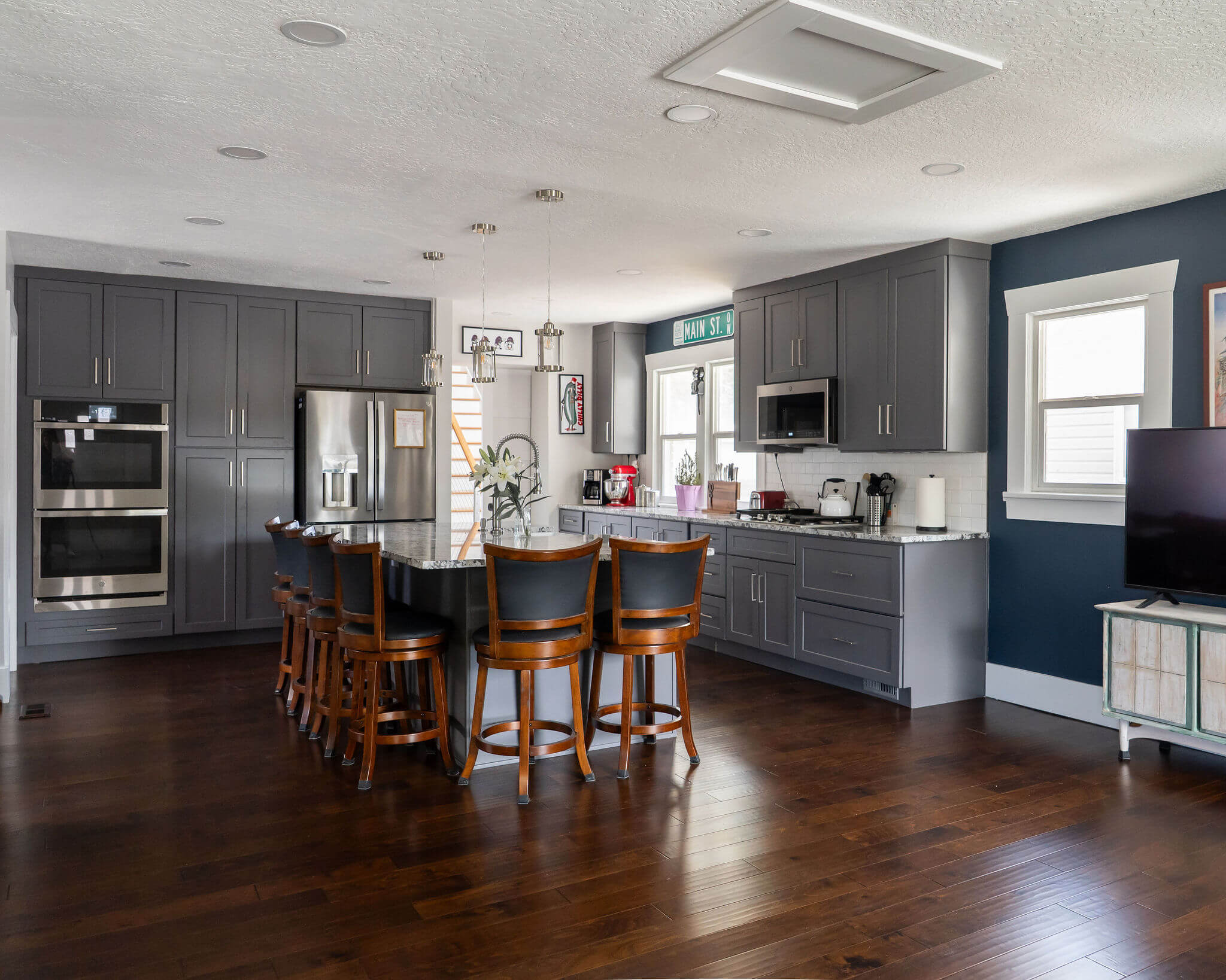 Renovated kitchen featuring an open concept layout with lots of storage, a large island, and clear sightlines.