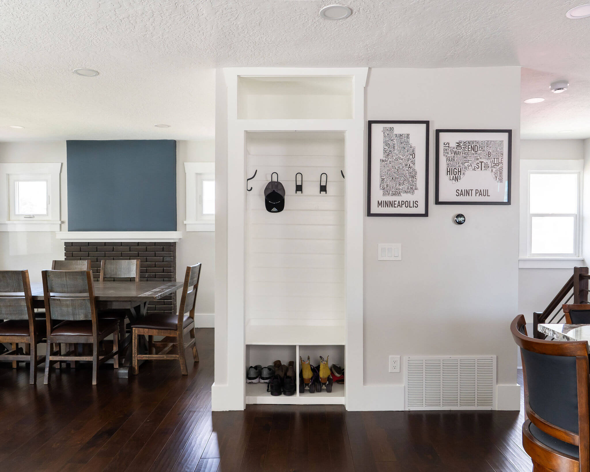 Open concept great room with a built-in storage cabinet between the dining room and kitchen.