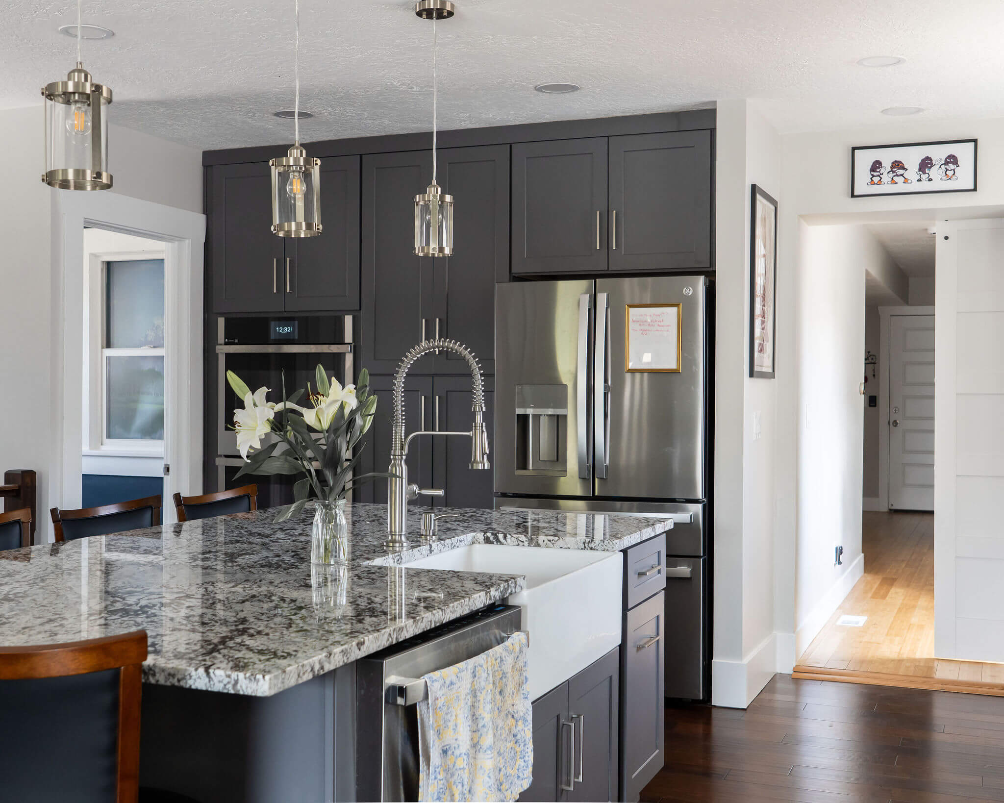 Renovated kitchen featuring an open concept layout with lots of storage, a large island, and clear sightlines.