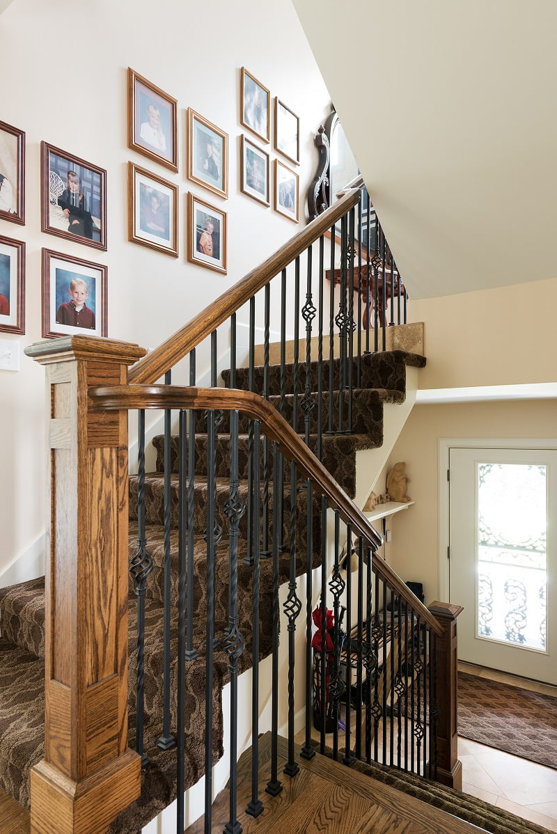 Stair case second story adition on Tudor home | Renovation Design Group