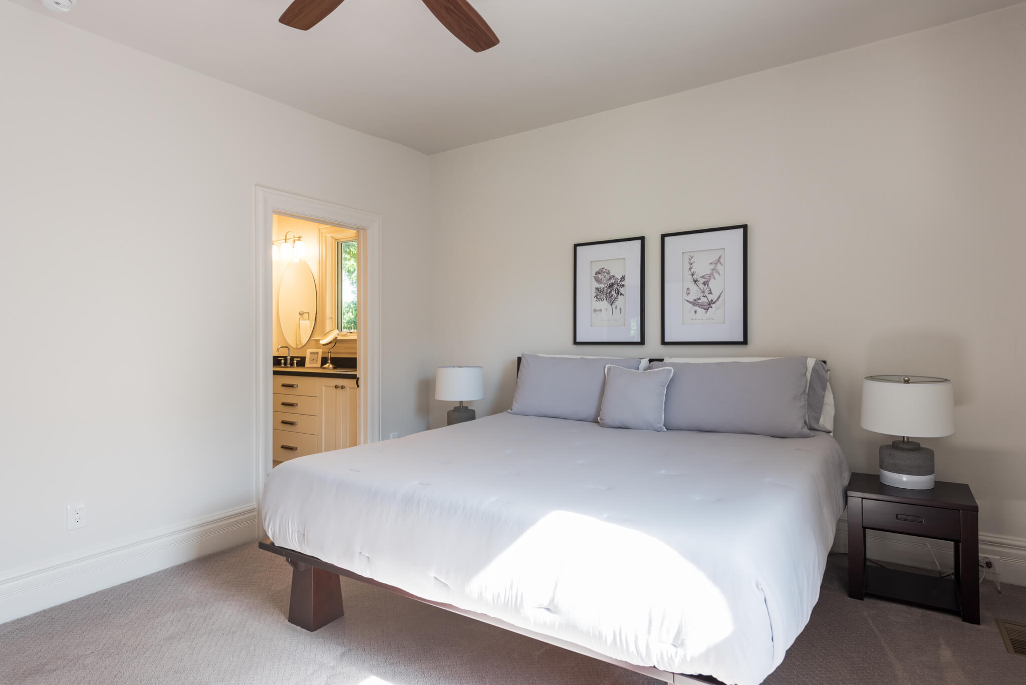 Primary bedroom with view to the ensuite bathroom