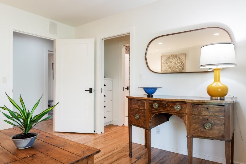 Office with doors open to the hallway and closet.