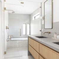 Thumbnail of http://Modern%20primary%20bathroom%20looking%20past%20the%20double%20sinks%20to%20the%20wet%20room%20with%20the%20shower%20and%20large%20tub.
