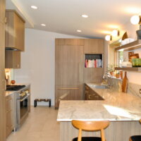 Thumbnail of http://Mid-century%20modern%20kitchen%20with%20peninsula%20and%20open%20shelving%20to%20maximize%20the%20space.