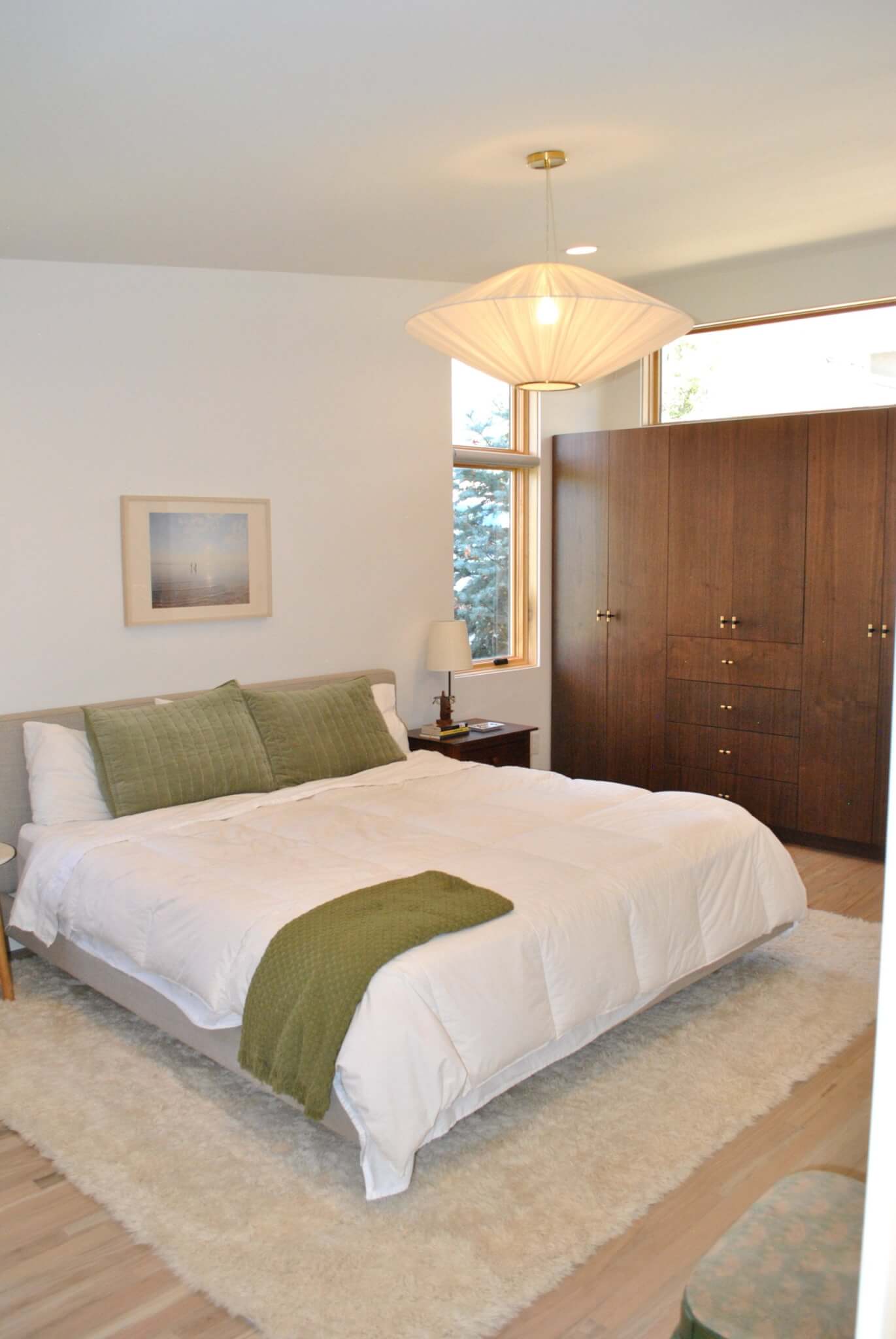 Primary bedroom with a mid-century modern design and cabinets for a built-in closet.