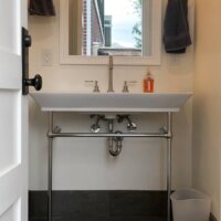 Thumbnail of http://Bathroom%20sink%20with%20a%20mirror%20above.