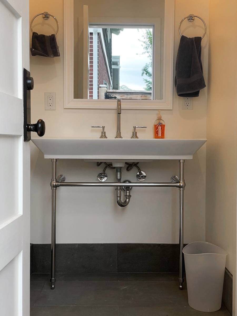 Bathroom sink with a mirror above.