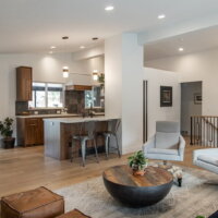 Thumbnail of http://Open%20concept%20contemporary%20great%20room%20with%20vaulted%20ceilings.%20The%20living%20room%20is%20open%20to%20the%20entry,%20dining%20room,%20and%20partially%20to%20the%20kitchen.%20The%20part%20of%20the%20kitchen%20that%20is%20open%20incudes%20a%20peninsula%20with%20two%20bar%20stools.