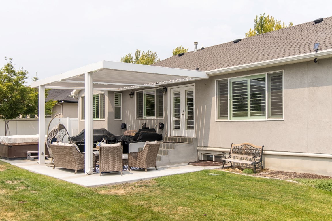 Renovated back patio with a retractable pergola.