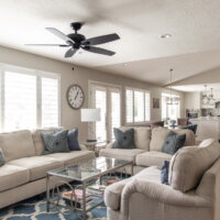 Thumbnail of http://Open%20concept%20great%20room%20looking%20from%20the%20family%20room%20to%20the%20dining%20room%20and%20kitchen.%20The%20family%20room%20features%20two%20sofas%20and%20a%20chair%20around%20a%20coffee%20table%20with%20a%20ceiling%20fan%20above.