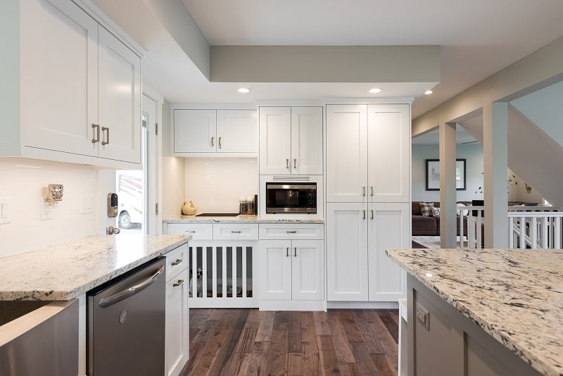 Cape Home, Open floor Plan, Kitchen remodels, Great room, white cabinets, modern designs, custom dog entrance | Renovation Design Group