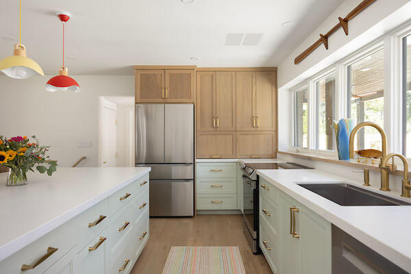 Thoughtfully renovated kitchen. The cabinets are in an l-shape with a large island in the center.