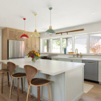 Thumbnail of http://Custom%20kitchen%20remodel%20featuring%20a%20colorful%20design,%20open%20concept%20layout,%20and%20lots%20of%20storage.%20An%20island%20is%20in%20the%20center%20with%20seating%20for%20three.