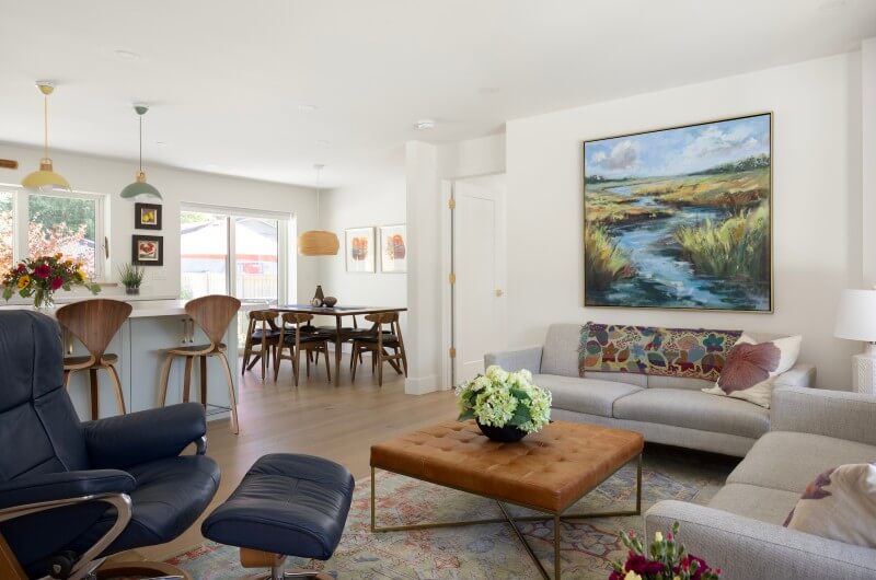 Open concept living room looking from the thoughtfully designed living room to the dining room and kitchen.