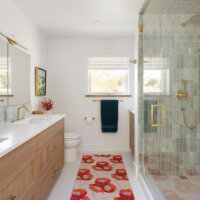 Thumbnail of http://Primary%20bathroom%20with%20a%20double%20vanity,%20toilet,%20storage,%20and%20large%20shower.