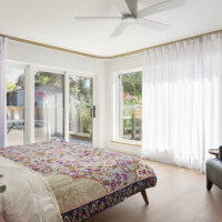 Thumbnail of http://Primary%20bedroom%20design%20with%20lots%20of%20natural%20light%20and%20curtains%20all%20the%20way%20around.
