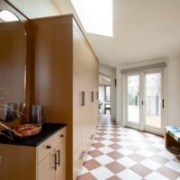 Thumbnail of http://Mudroom%20after%20the%20remodel%20featuring%20a%20fun%20tile%20pattern%20on%20the%20floor,%20built-in%20cabinets,%20and%20lots%20of%20natural%20light