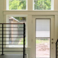 Thumbnail of http://Staircase%20leading%20to%20the%20back%20door%20with%20windows.