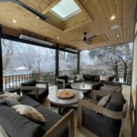 Thumbnail of http://Outdoor%20covered%20deck%20with%20fans,%20skylights,%20and%20seating.